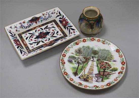 A Hadleys Worcester small vase, painted with iris, a Royal Worcester Prince Regent dish and a garden design plate
